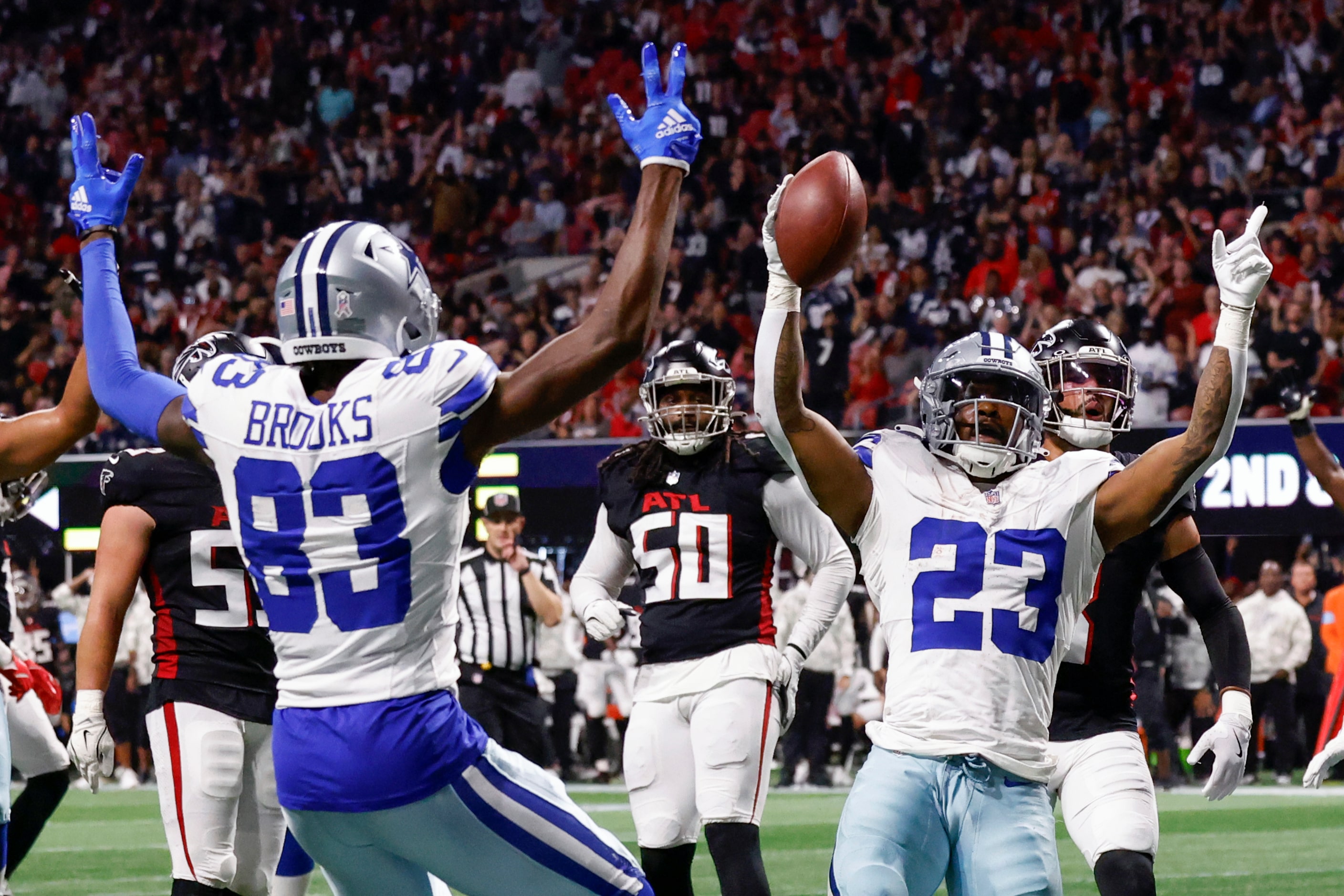 Dallas Cowboys running back Rico Dowdle (23) celebrates his touchdown reception with wide...