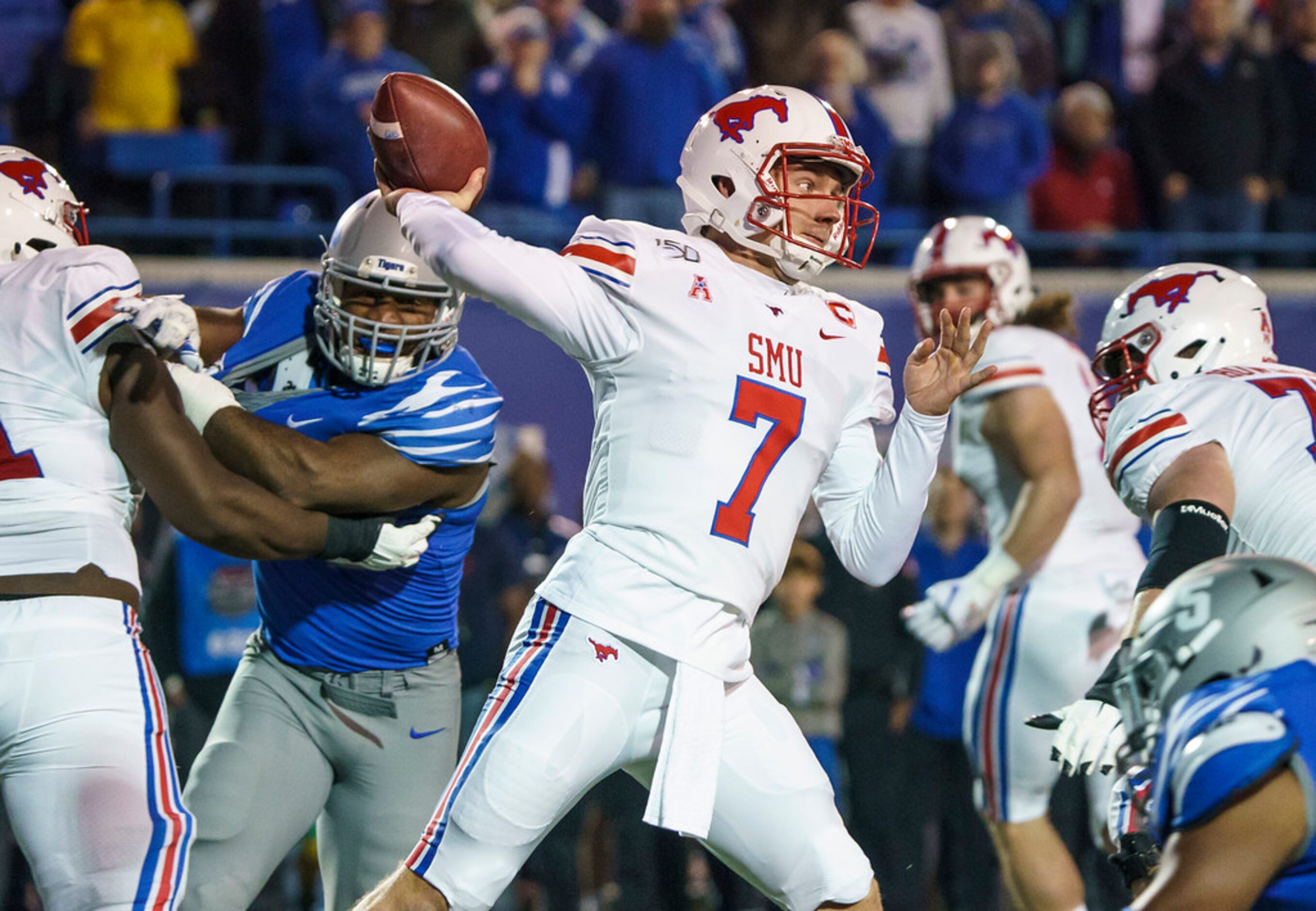 SMU quarterback Shane Buechele (7) throws a pass during the first half of an NCAA football...