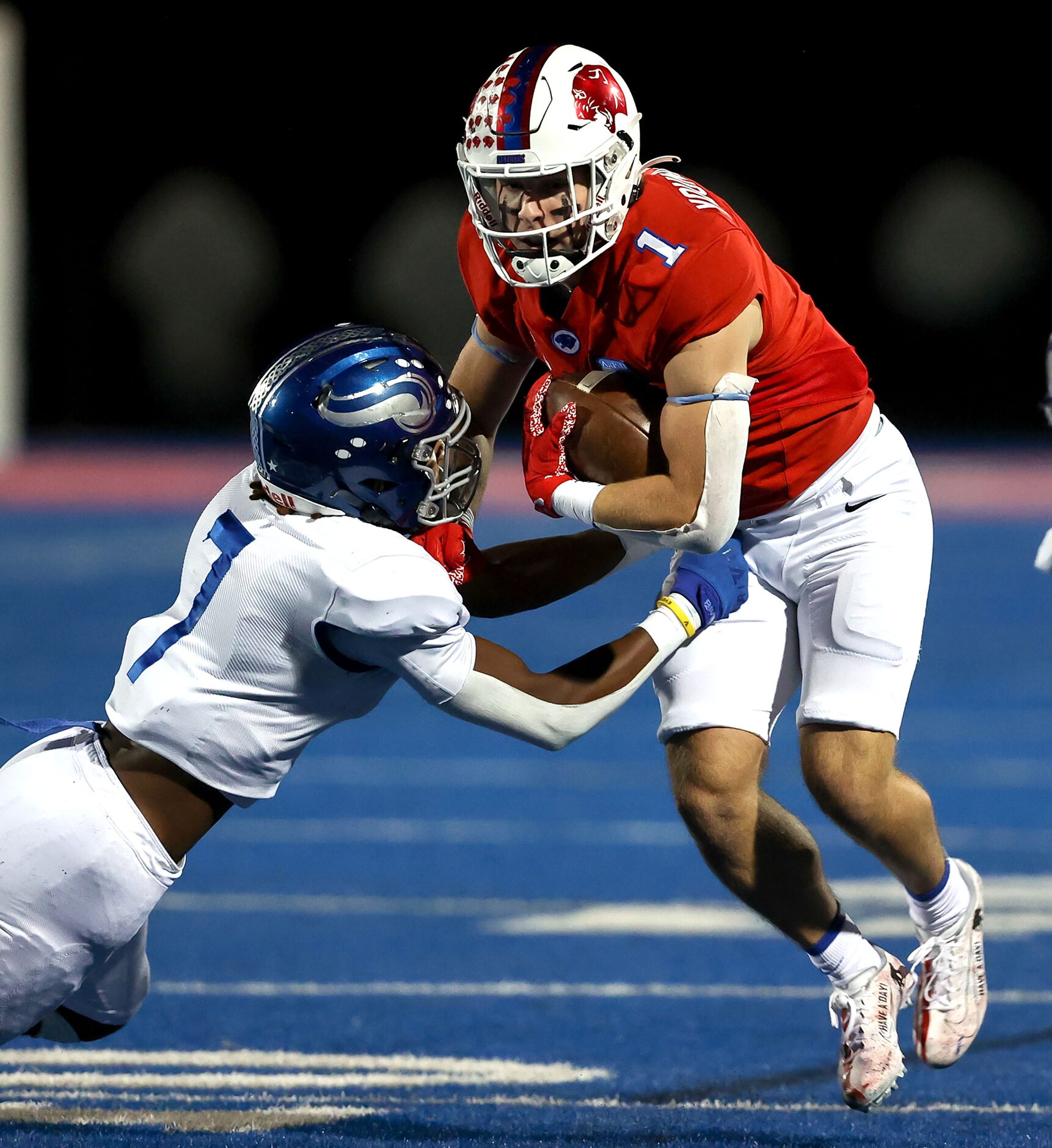 Parish wide receiver Blake Youngblood (1) comes up with a reception and tries to break free...