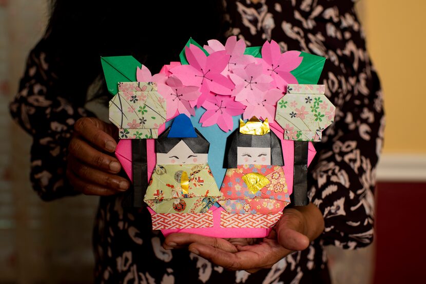 Jayashree Krishnan holds origami that she created at her home in Irving.