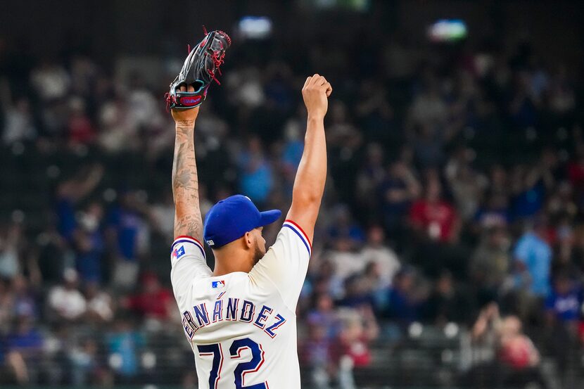 Texas Rangers relief pitcher Jonathan Hernandez (72) reacts after outfielder Bubba Thompson...