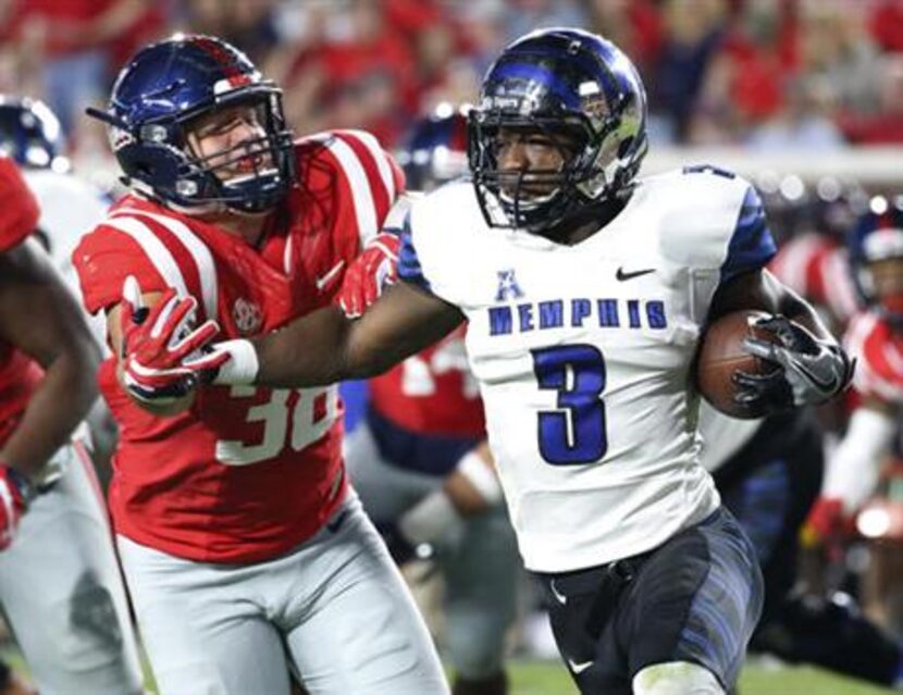 Memphis wide receiver Anthony Miller (3) pushes past Mississippi defensive end John...