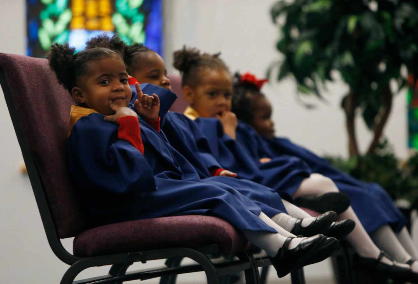 Pre-kindergartner Maliah Sadler sat on stage with other acolytes during a Valentine's Day...
