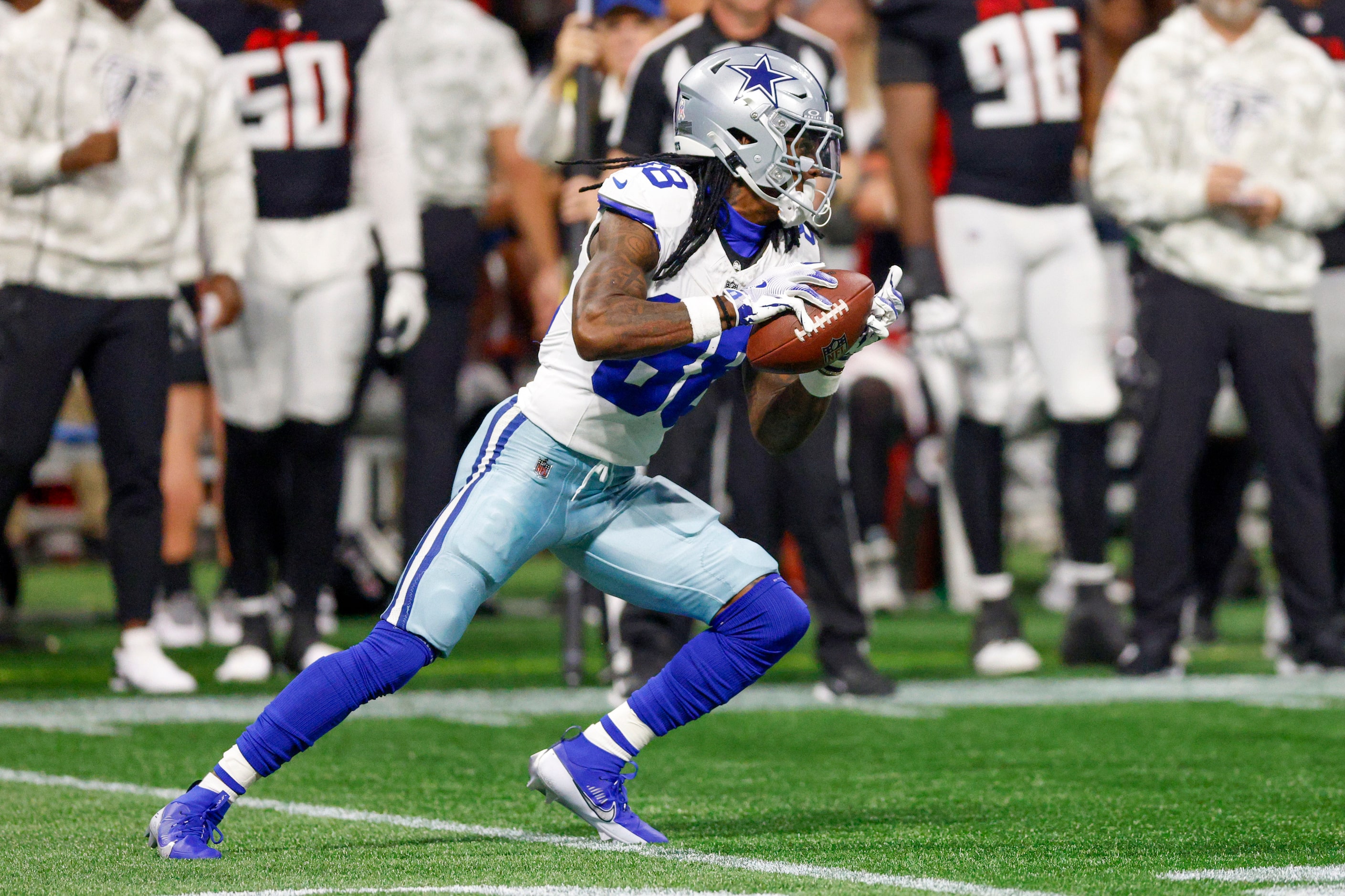 Dallas Cowboys wide receiver CeeDee Lamb (88) runs up field after making a catch during the...