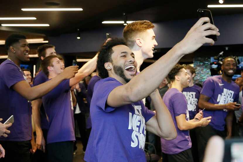 TCU junior guard Shawn Olden celebrates with his teammates after learning that they will be...