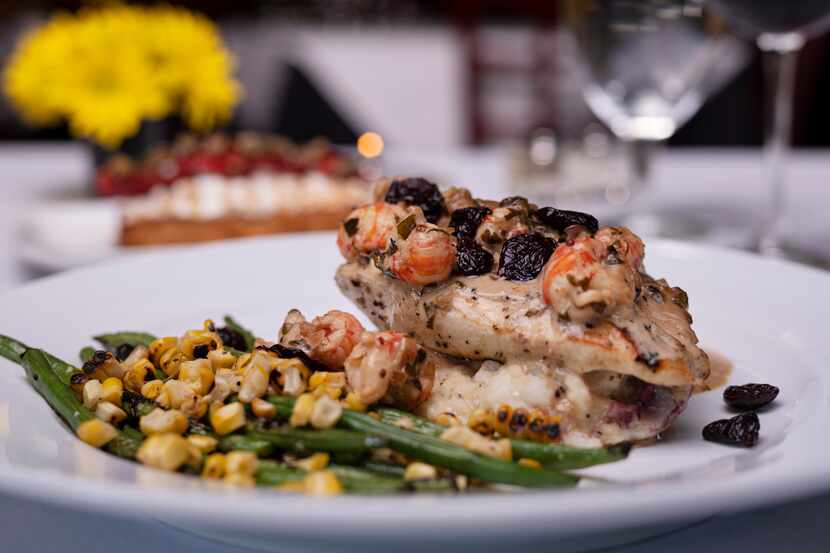 Grilled turkey breast with langoustine tails and cognac sauce and served with roasted...