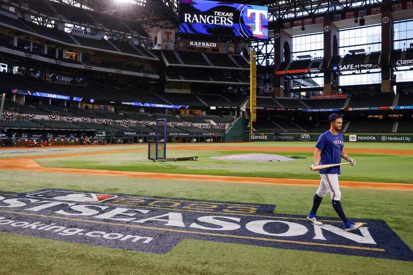 Texas Rangers third baseman Josh Jung heads to the locker room after a practice before Game...