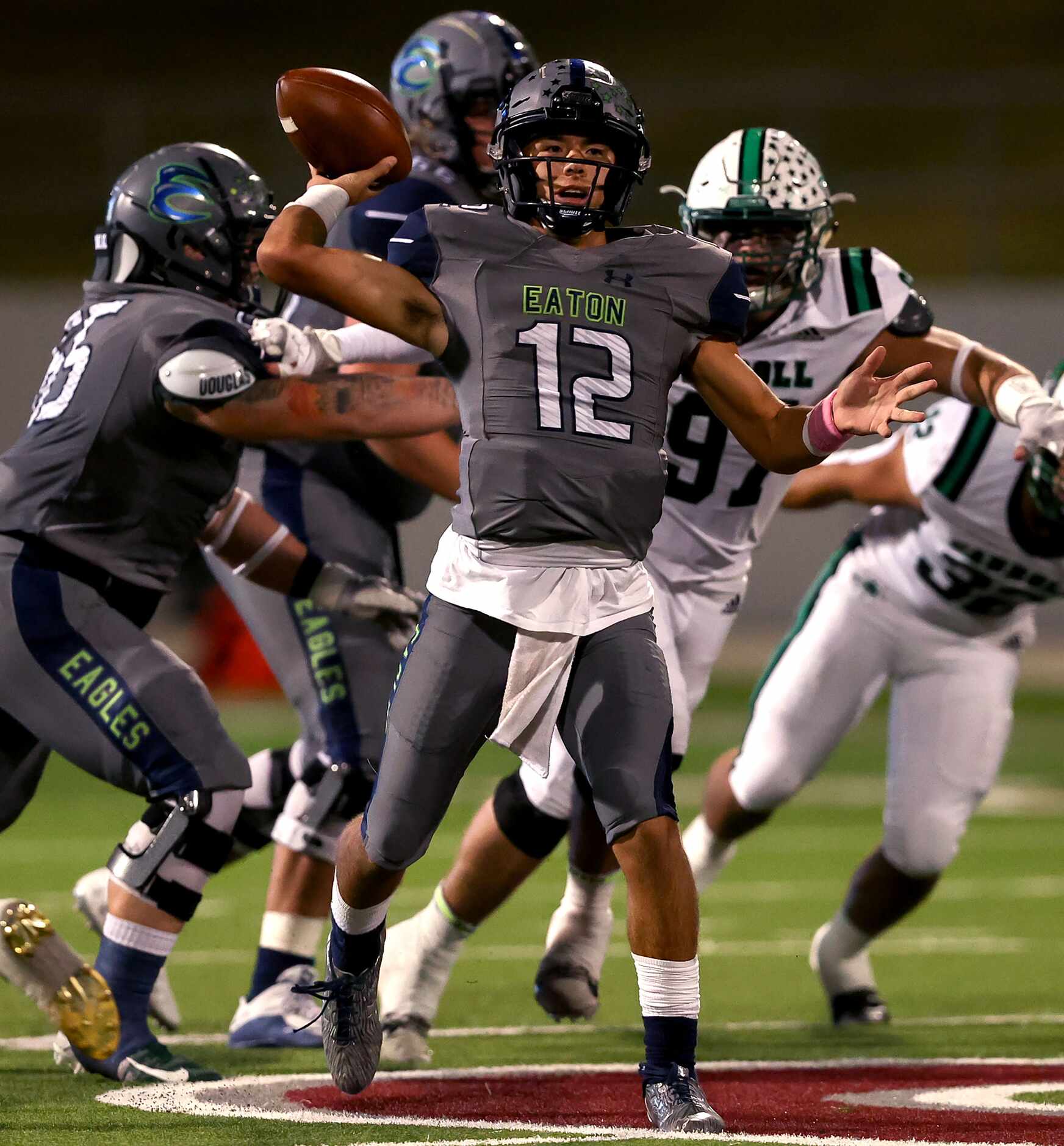 Eaton quarterback Tyler Fussell (12) attempts a pass against Southlake Carroll during the...