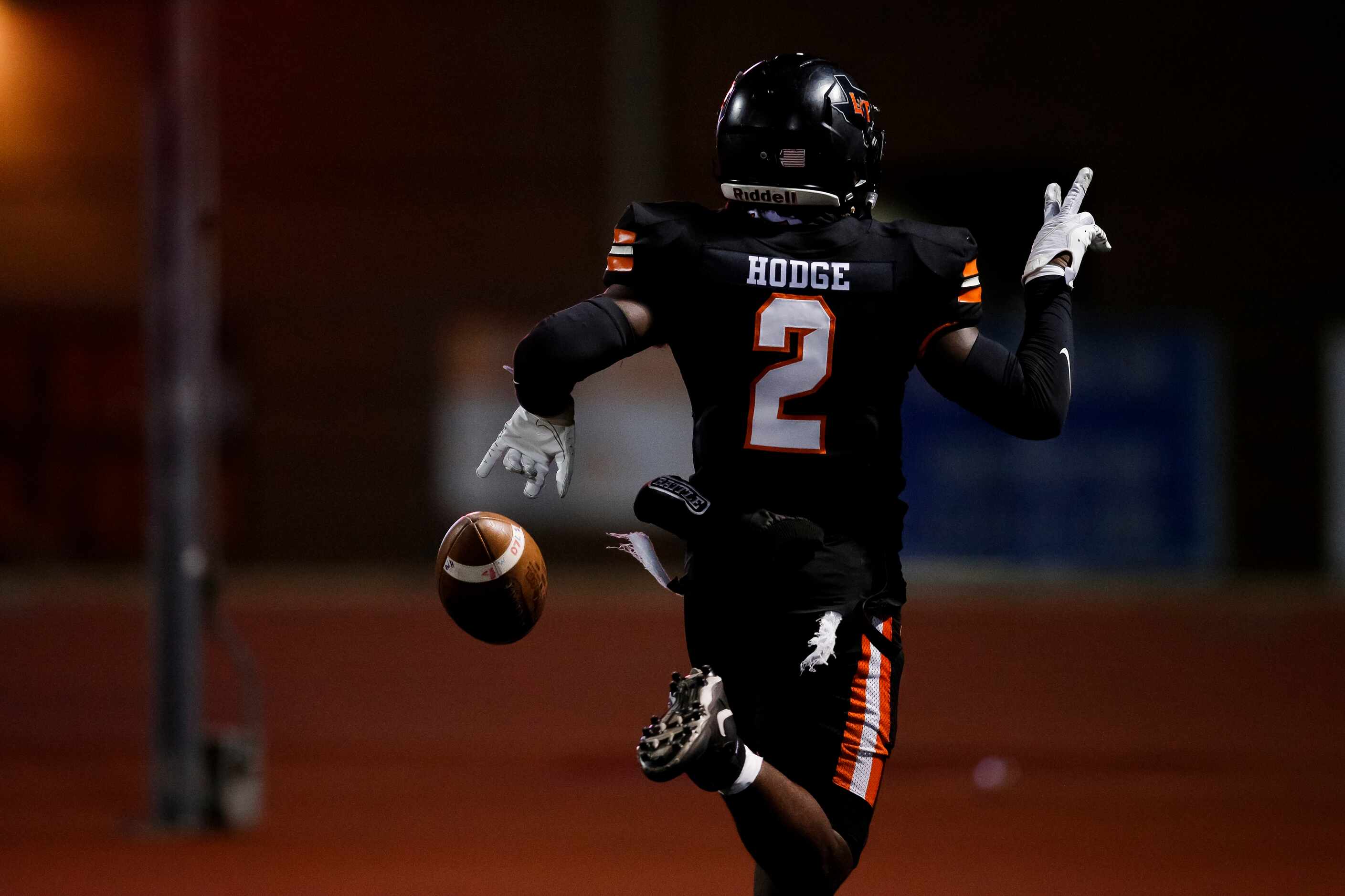 Lancaster senior defensive back Davion Hodge (2) celebrates returning a blocked field goal...