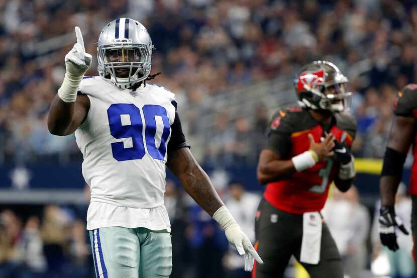 FILE - In this Dec. 23, 2018, file photo, Dallas Cowboys defensive end DeMarcus Lawrence...