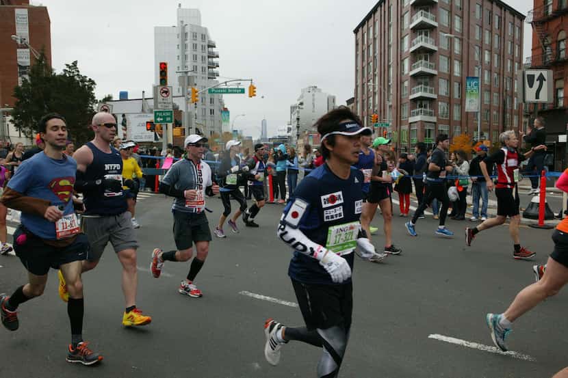 Runners compete in the ING New York City Marathon in New York on Sunday, November 3, 2013....
