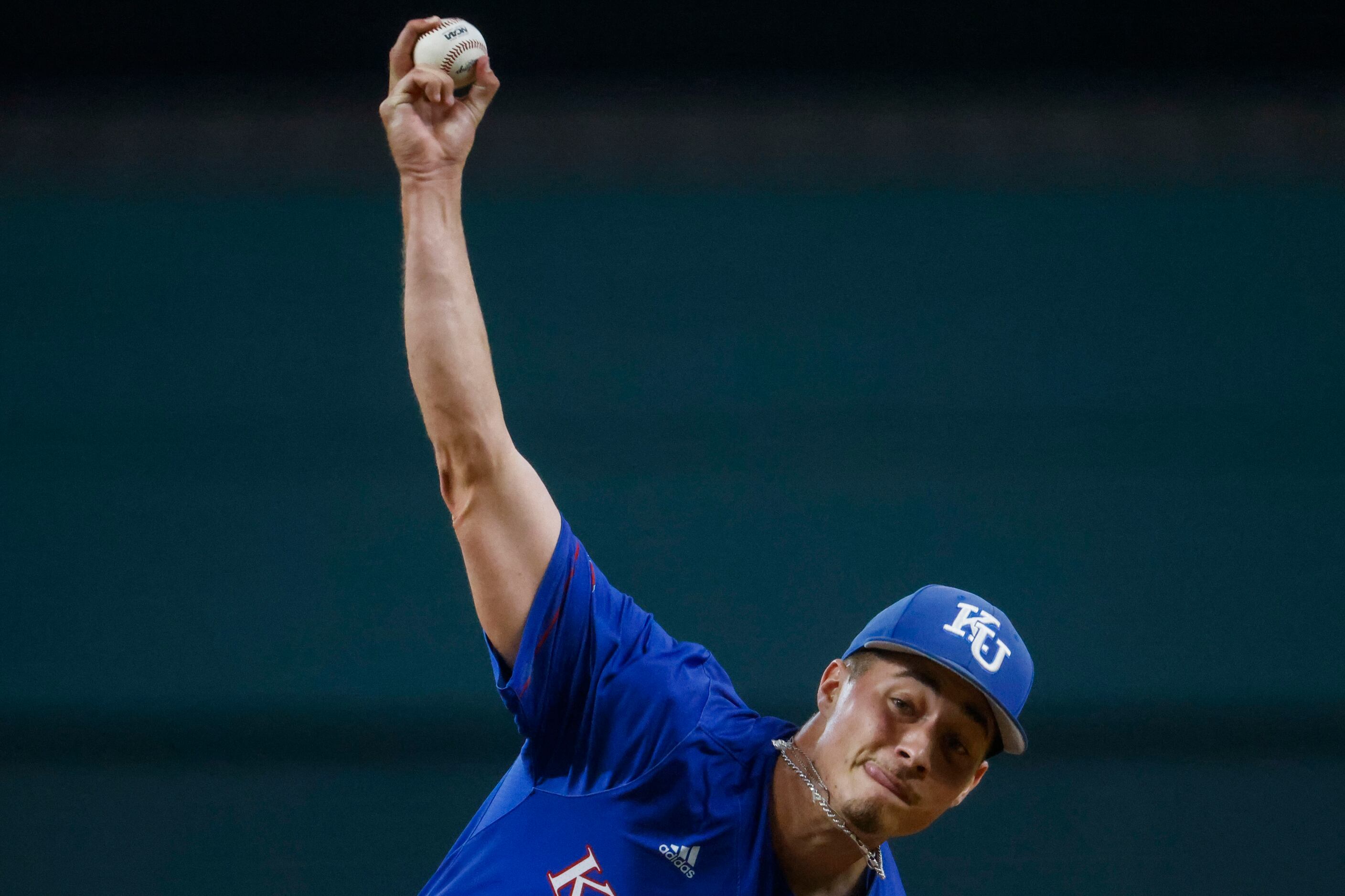 Kansas pitcher Kolby Dougan throws during the fourth inning of a baseball game against...