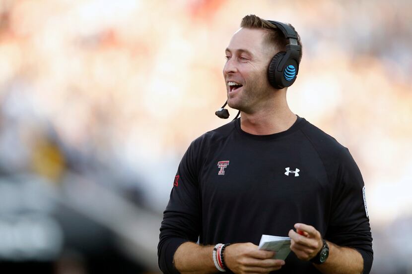 FILE - In this Sept. 17, 2016, file photo, Texas Tech coach Kliff Kingsbury cheers after...