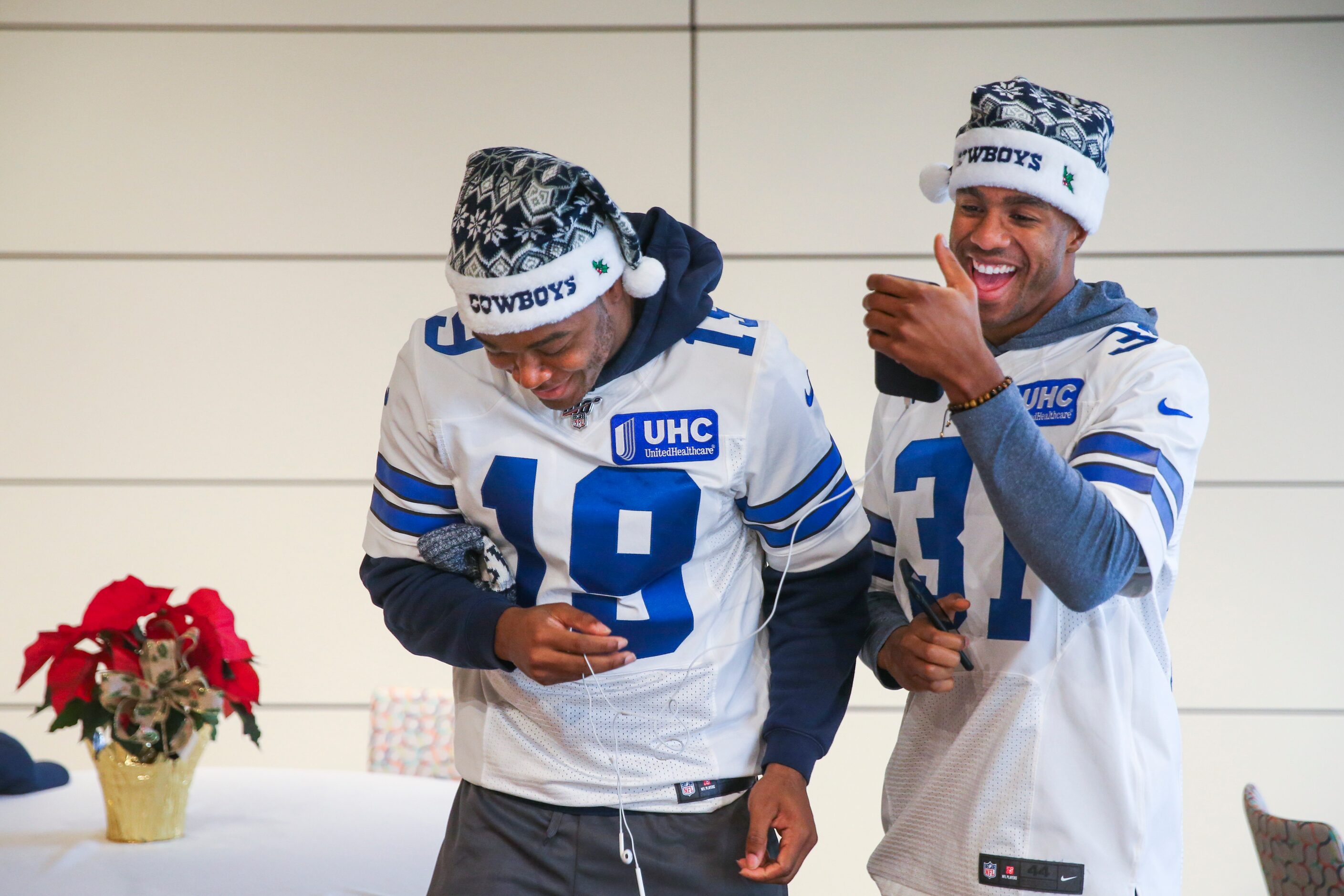 Dallas Cowboys wide receiver Amari Cooper (19) laughs after watching a video on cornerback...