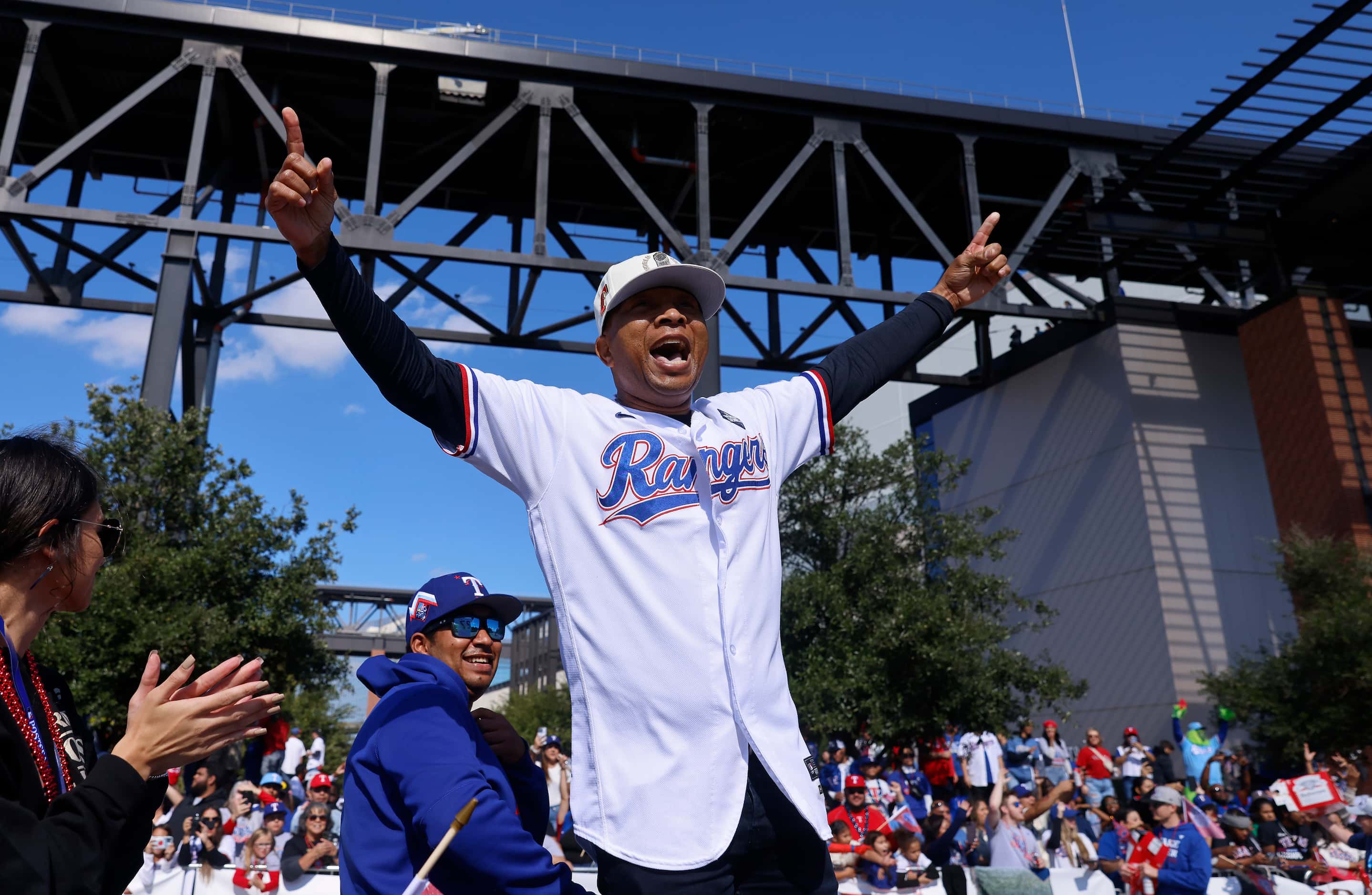 Texas Rangers third base coach Tony Beasley waves to fans during the World Series Victory...