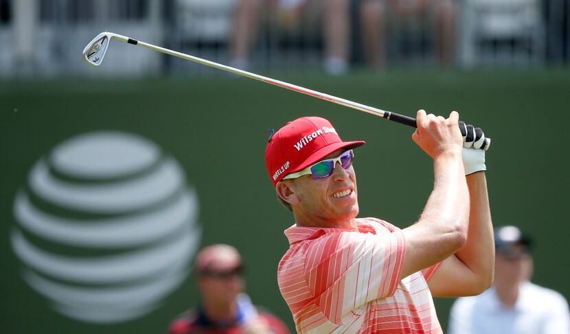 Ricky Barnes watches his tee shot on the 17th hole during the first round of the Byron...