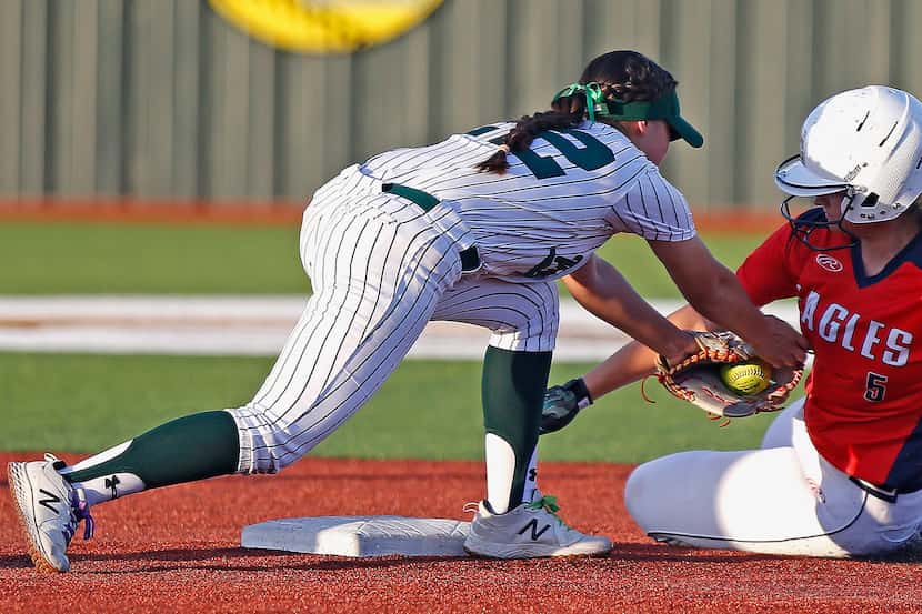 Allen's Brooklyn Purtell (5) is tagged out at second base by Prosper's Ezra Arredondo (22)...