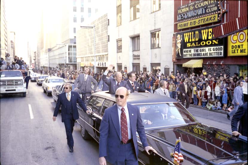President Gerald Ford waves to the crowd along Commerce St. during the State Fair of Texas...