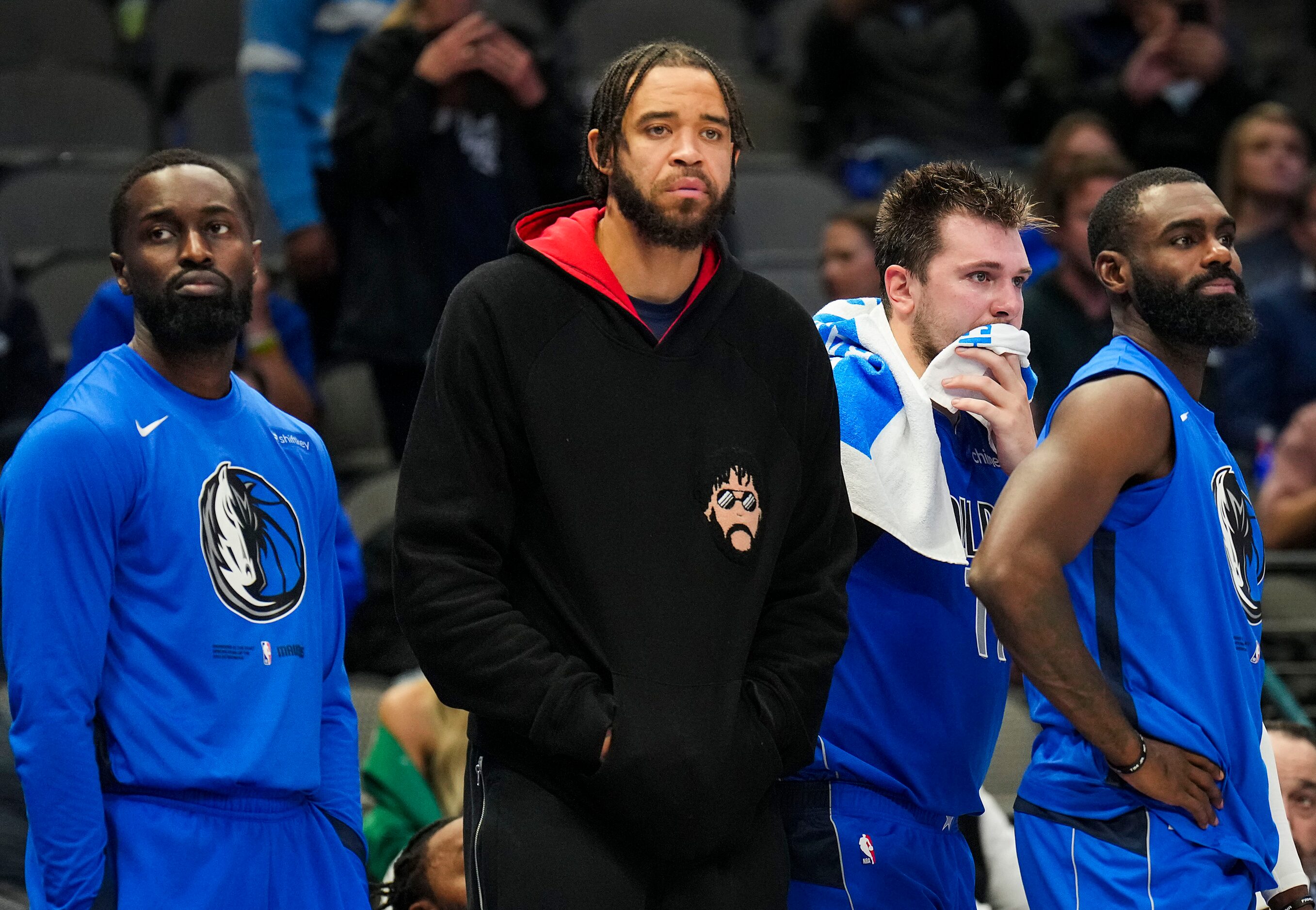 From left, Dallas Mavericks guard Theo Pinson, center JaVale McGee, guard Luka Doncic and...