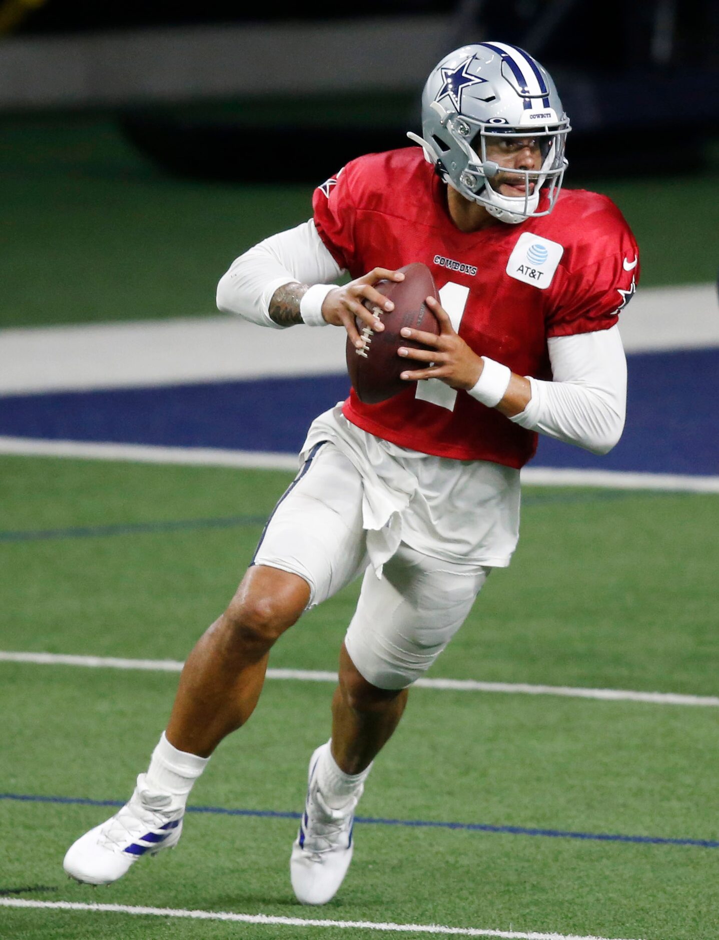 Dallas Cowboys quarterback Dak Prescott (4) runs through a drill in practice during training...