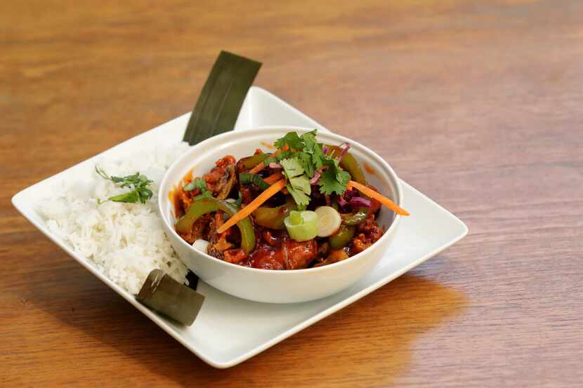 Spicy orange chili cauliflower with basmati rice is served by Lucky Cat Vegan, exclusive to...