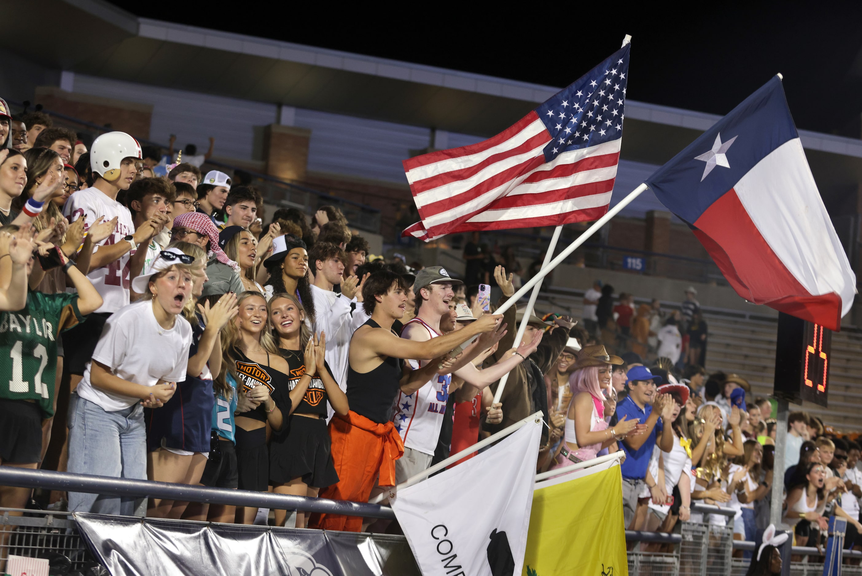 Allen fans cheer after a touchdown during the Prosper High School at Allen High School...