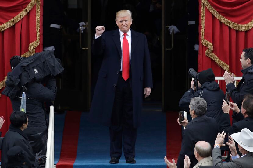 President-elect Donald Trump pumps his fist as he arrives for his Presidential Inauguration...