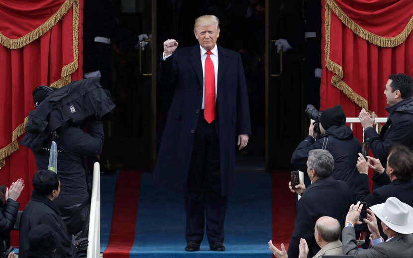 President-elect Donald Trump pumps his fist as he arrives for his Presidential Inauguration...