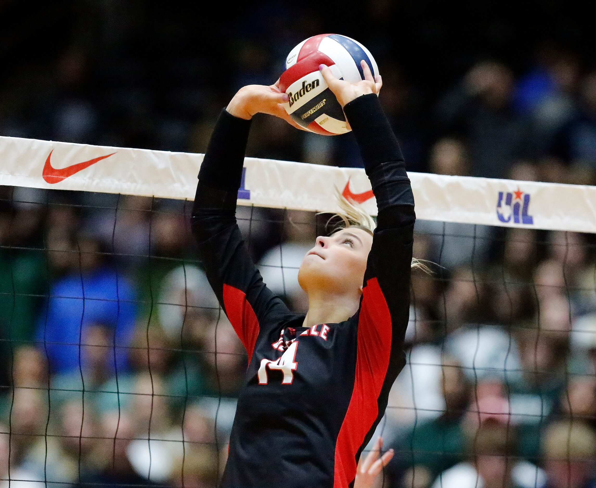 Colleyville Heritage High School setter Morgan Howard (14) makes a set during game three as...