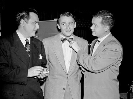 Hollywood reporters Herb Stein (left) and Bob Thomas (right) interview Alan Young on the set...