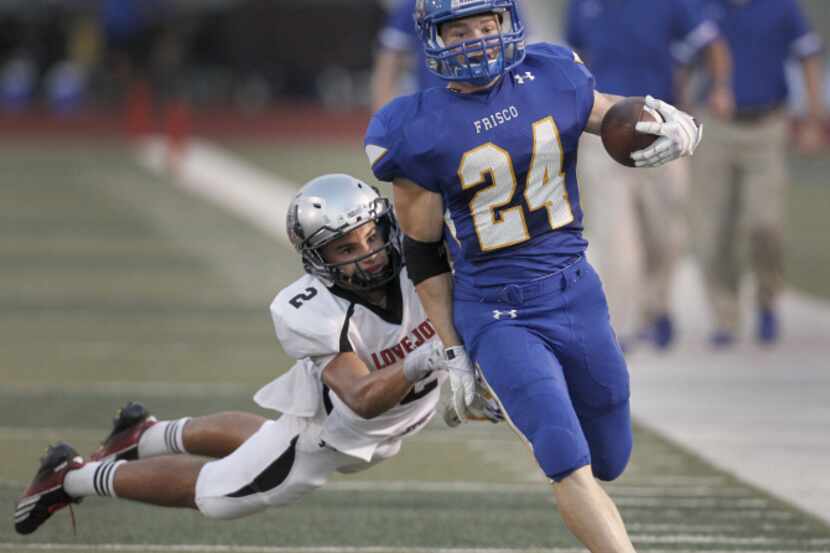 Frisco Raccoons Max Steitle (24) shakes off Lovejoy Leopards Aaron Fuller (2) in the first...