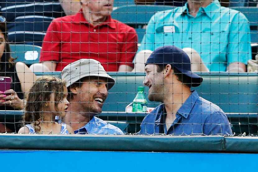 Blending in a little: Actor Matthew McConaughey  visited with Cowboys quarterback Tony Romo...