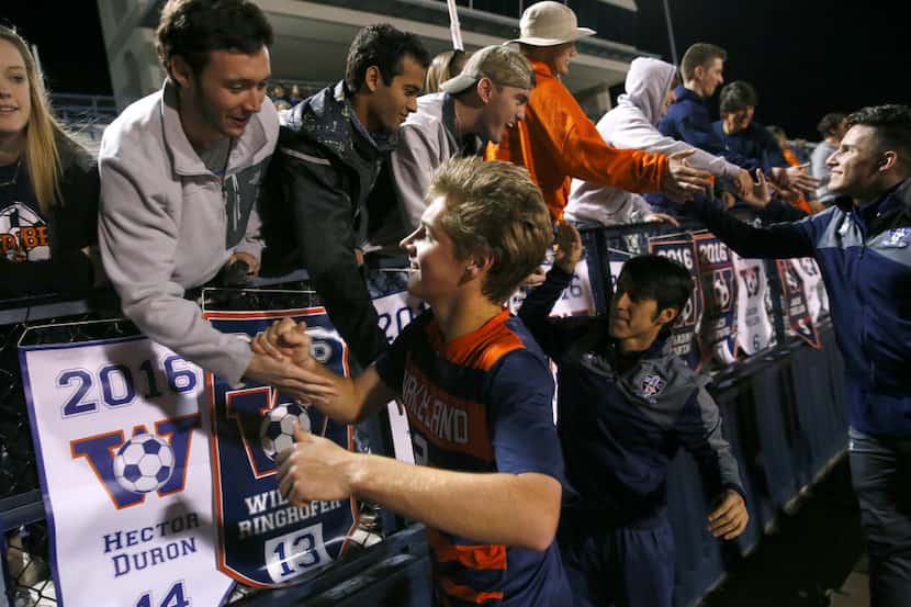 Frisco Wakeland's Cody Thomas (2) is congratulated on their win over Wylie East in their 5A...