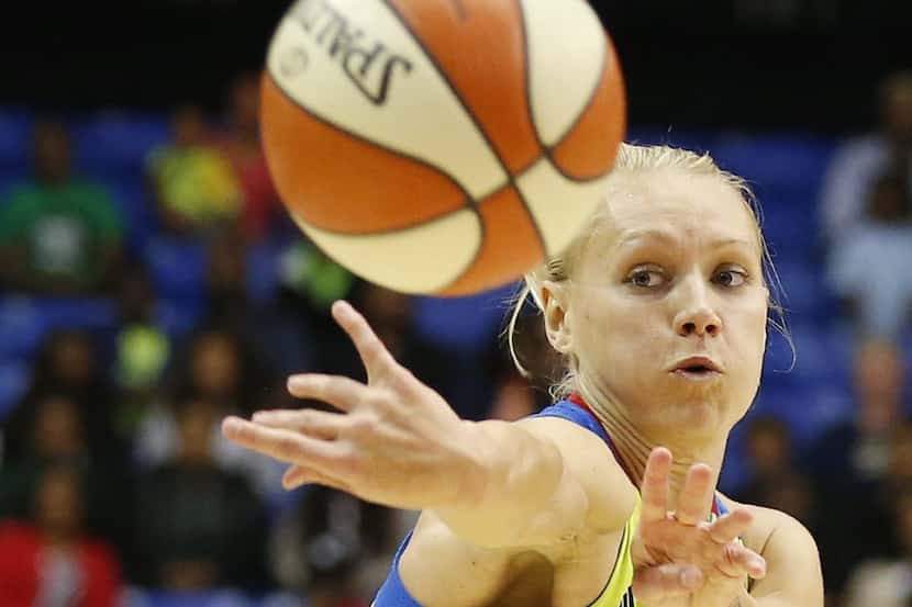 Dallas Wings guard Erin Phillips (31) passes the ball in the first half during a Women's...