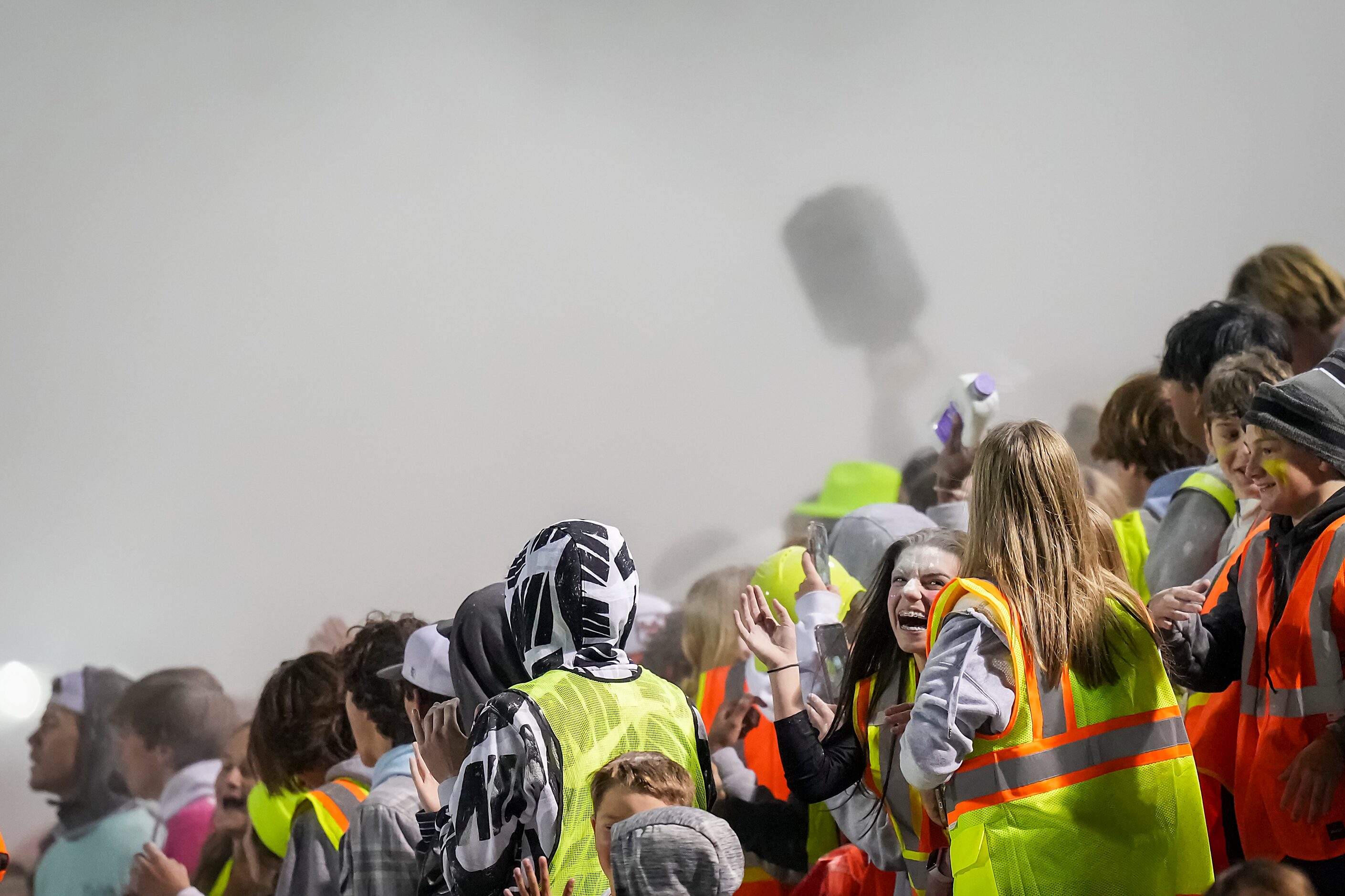 Baby powder flies over the Denton Guyer student section in celebration during the second...