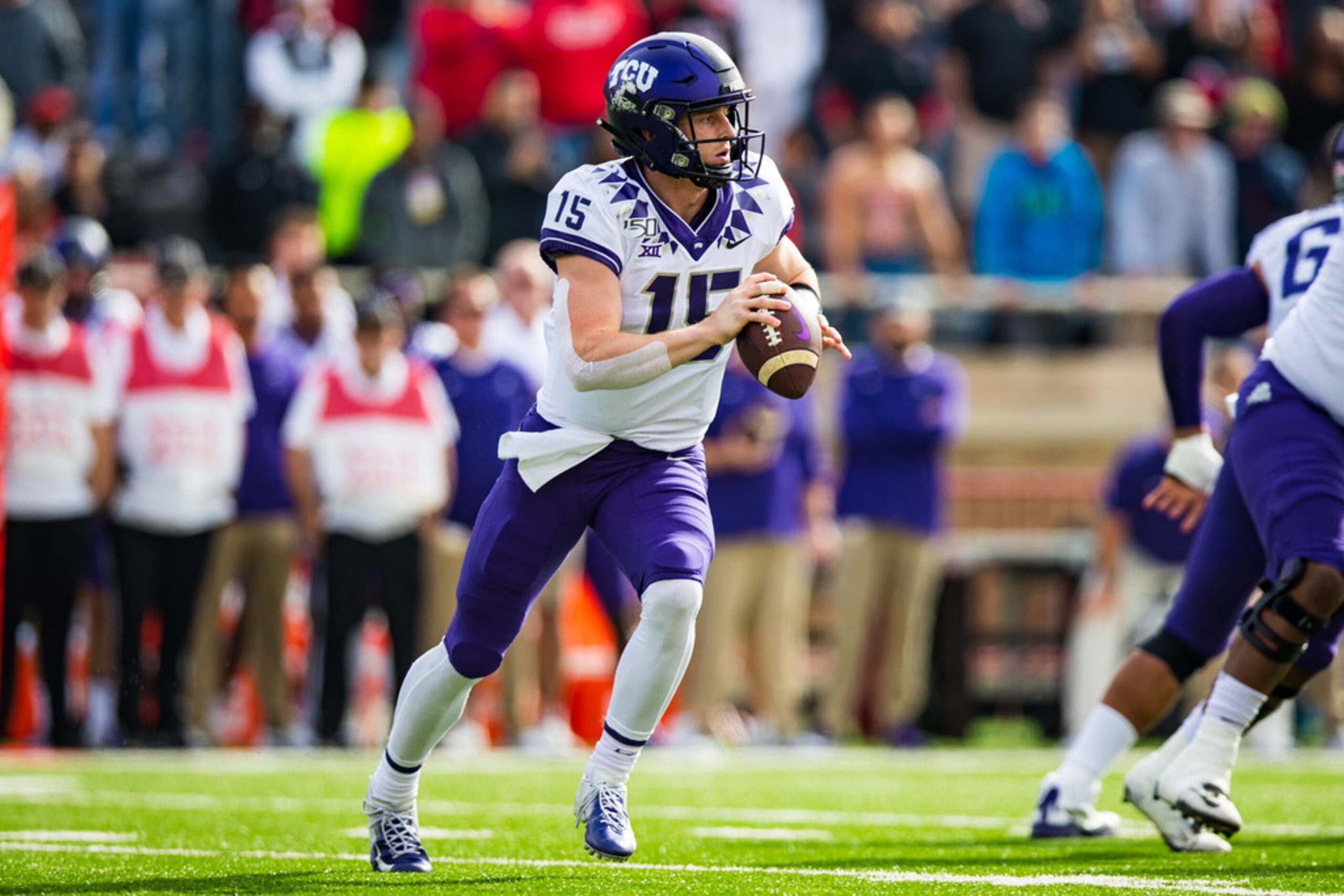 LUBBOCK, TEXAS - NOVEMBER 16: Quarterback Max Duggan #15 of the TCU Horned Frogs drops back...