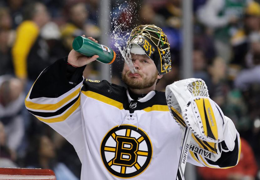 Boston Bruins goaltender Anton Khudobin takes a drink during the second period of an NHL...
