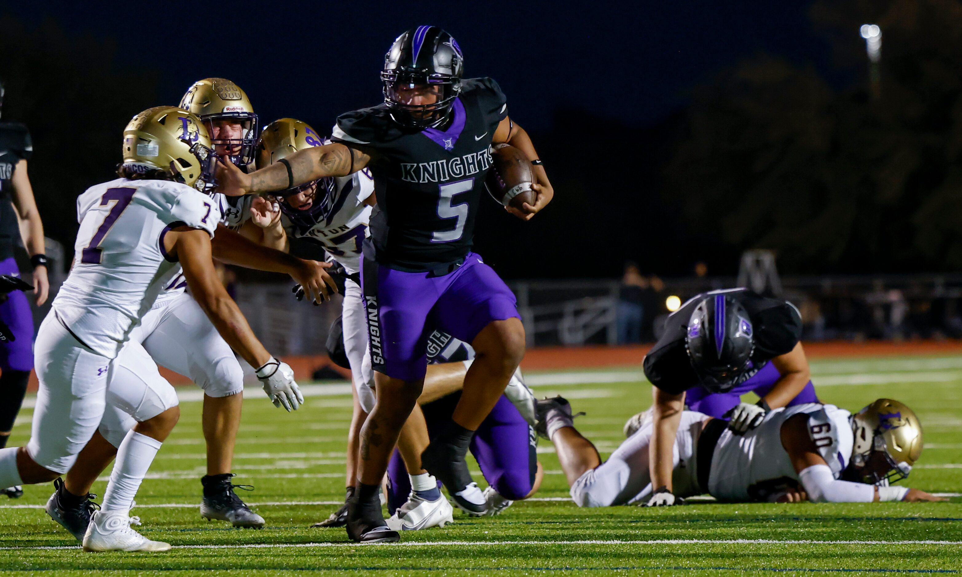 Frisco Independence’s running back Keith Rockwell (5) evades Denton’s linebacker Frankie...