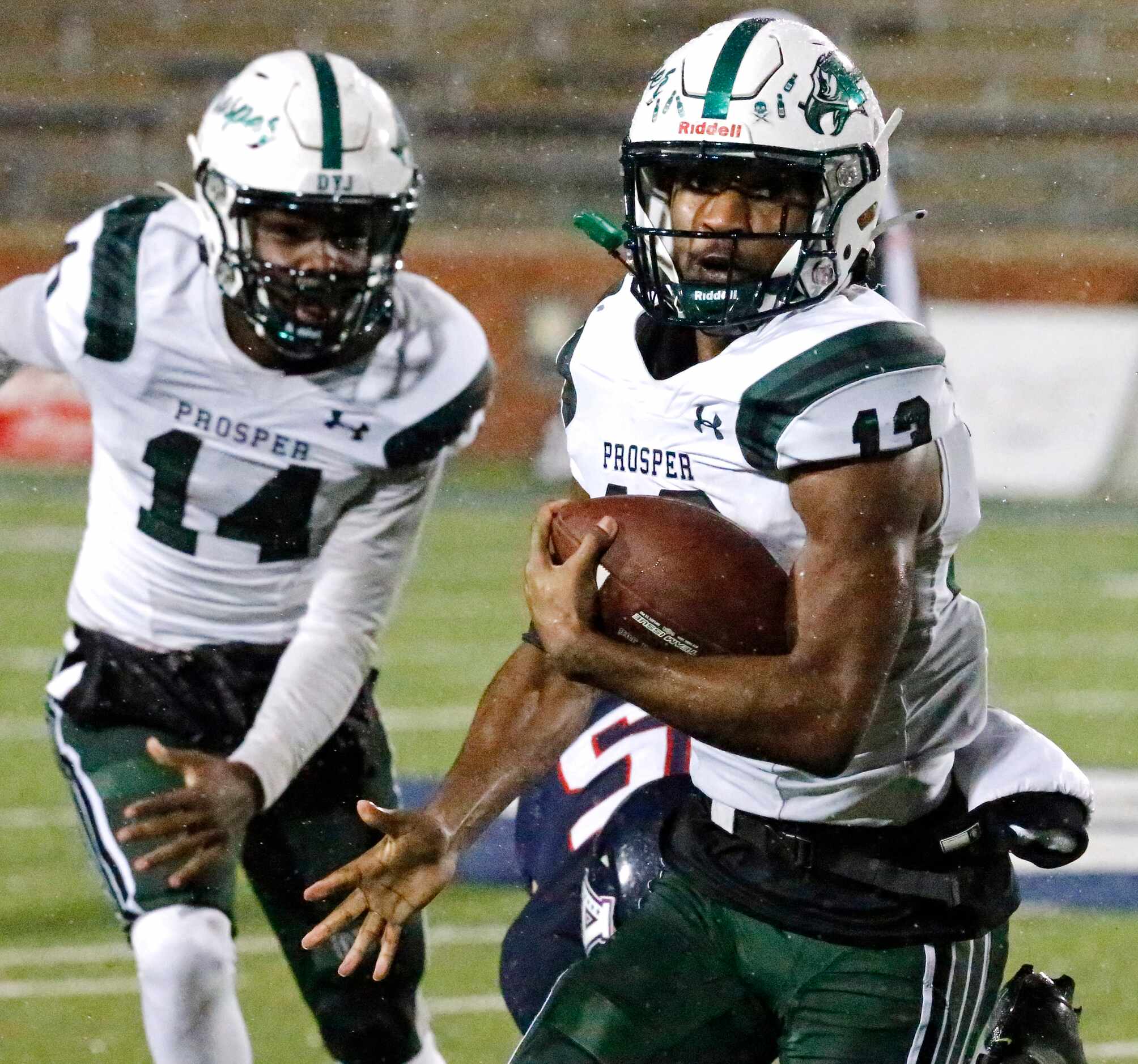 Prosper High School running back Prentice Sanders (13) carries the ball close to the end...