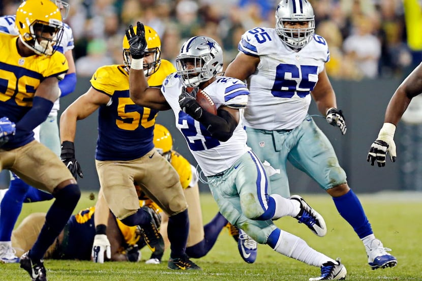 Dallas Cowboys running back Ezekiel Elliott finds a hole during Dallas' 30-16 win over the...