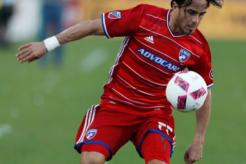 FC Dallas forward Mauro Rosales (77) handles the ball against Seattle Sounders in the second...
