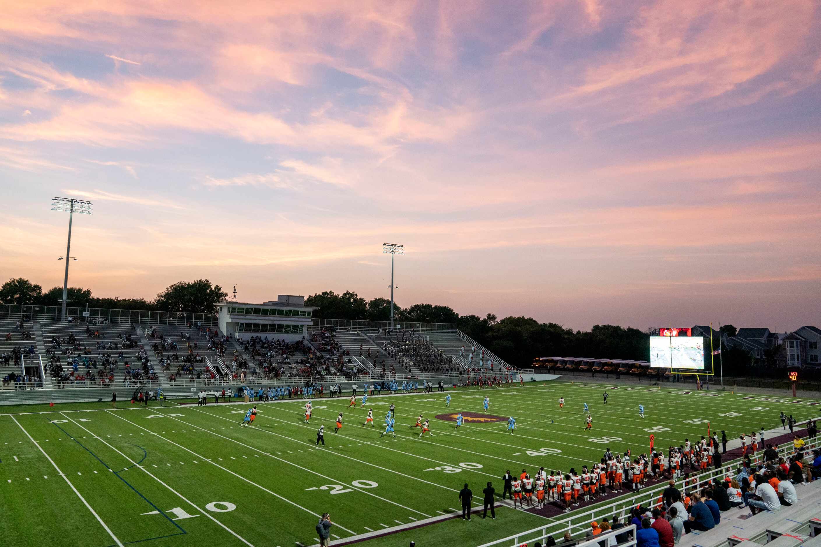 Lancaster runs a play against Skyline as the sun sets over Forester Field during the first...