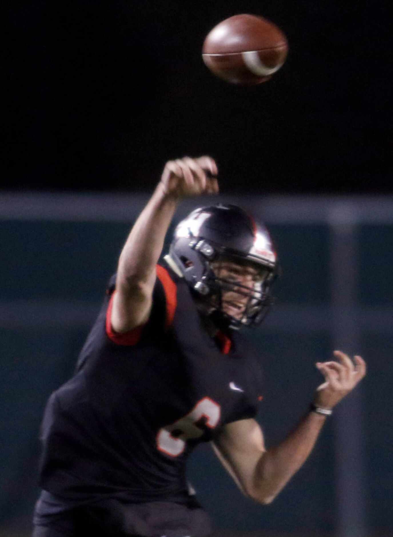 Lake Highlands quarterback Mitch Coulson (6) launches a pass downfield during first half...