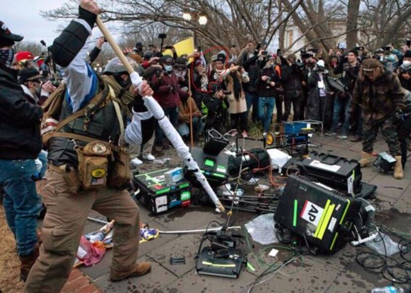 Jenna Ryan is shown here watching rioters destroy press equipment on the Capitol grounds.