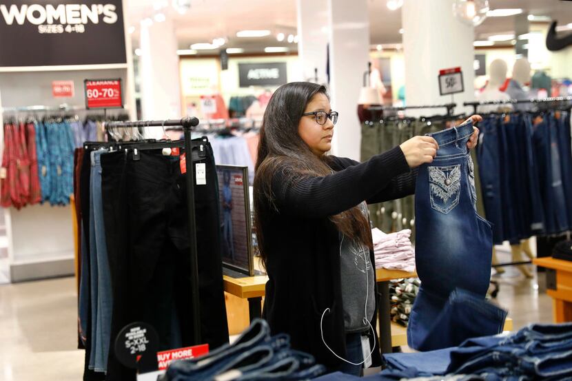 Erika Licea of Plano shops for her first pair of Levi's jeans in the Collin Creek Mall J.C....