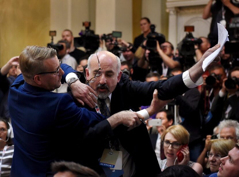 Security removes an apparent protester before a joint press conference between U.S....