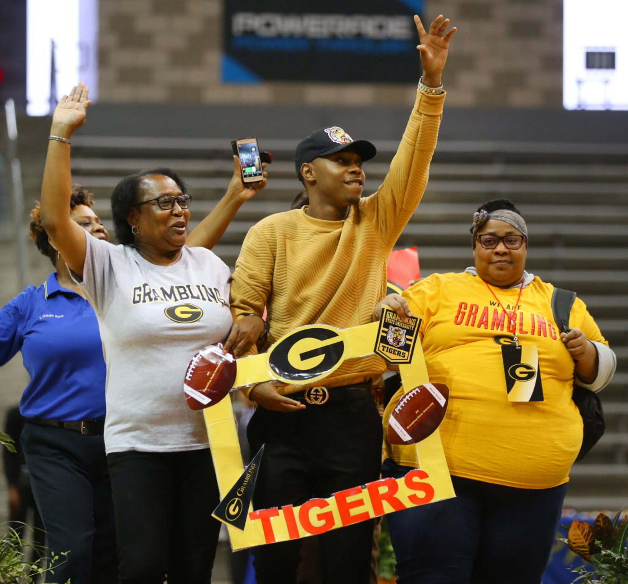 Carter High School's William Savala, who signed with Grambling State University, walks with...