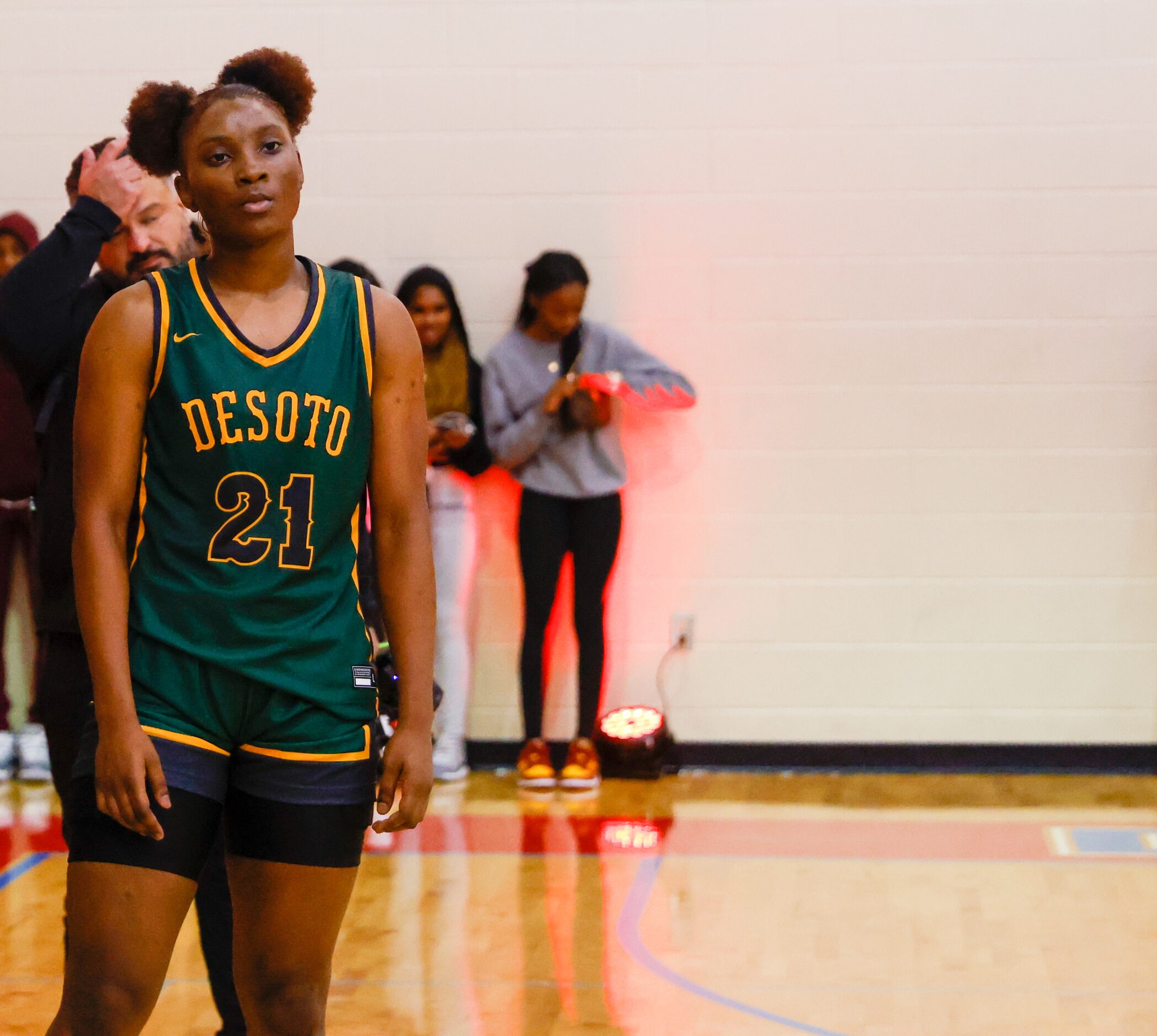 DeSoto shooting guard MaRiya Vincent (21) watches Montverde Academy players celebrate their...