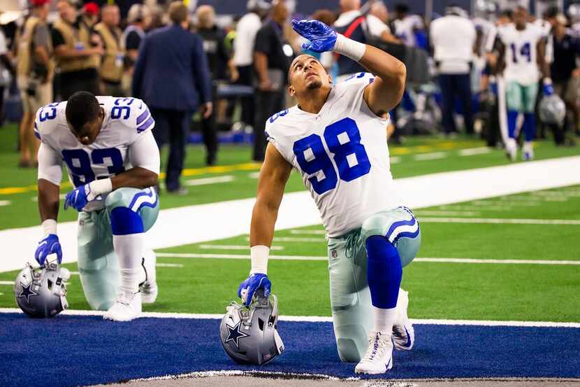 Dallas Cowboys defensive end Tyrone Crawford (98) and wide receiver Terrance Williams (83)...