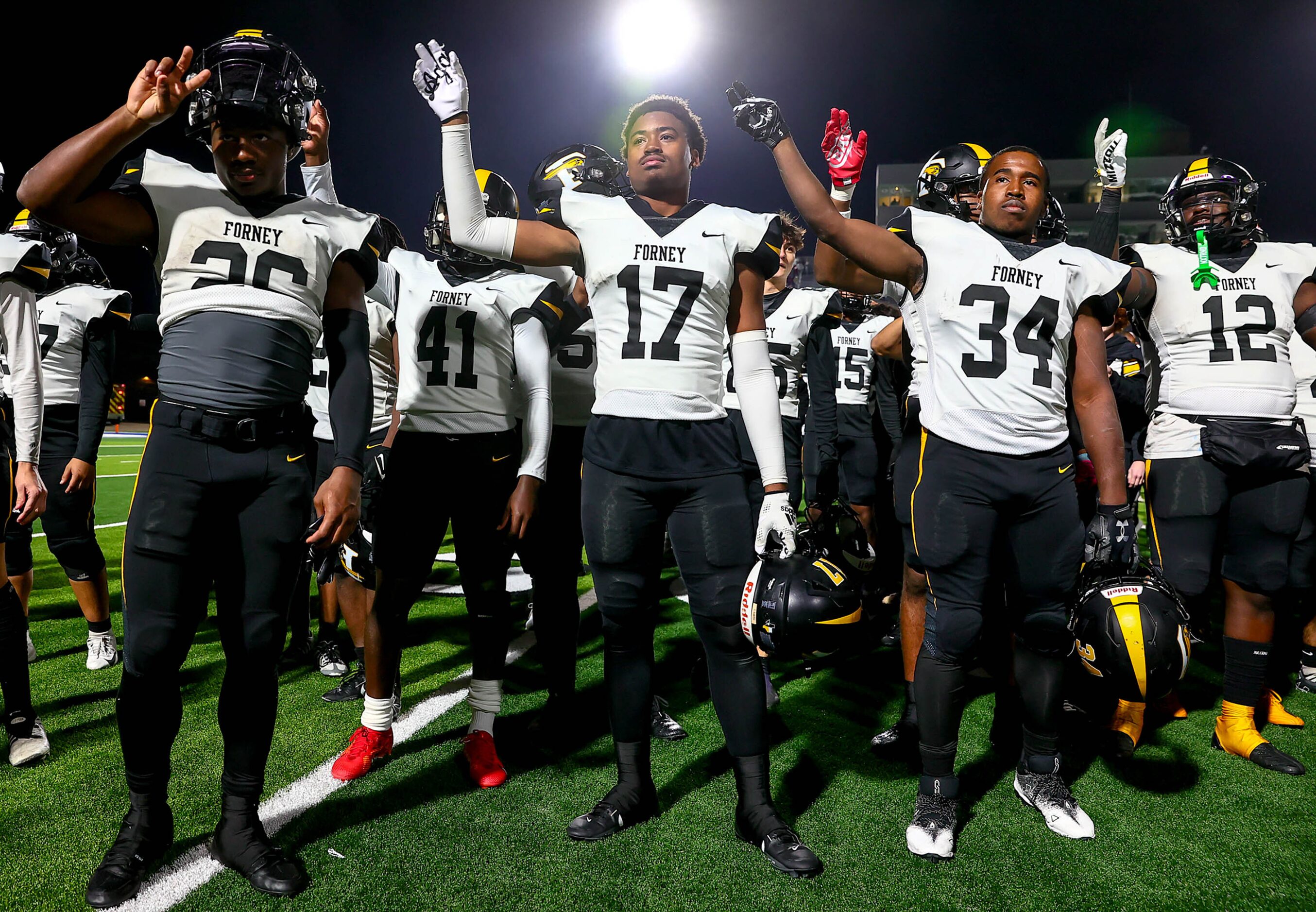 The Forney Jackrabbits celebrate their victory over Richland, 61-40 in the Class 5A Division...